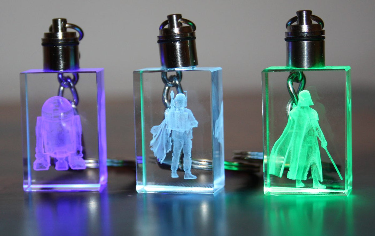 Crystal keyrings glowing purple, blue and green