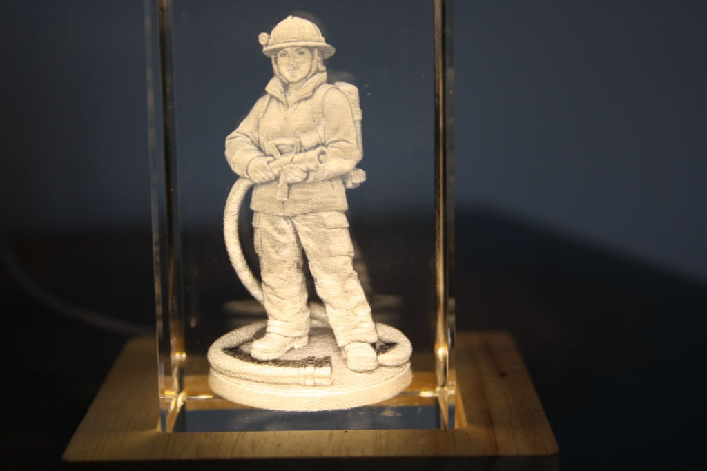 Firefighter engraved inside a crystal block