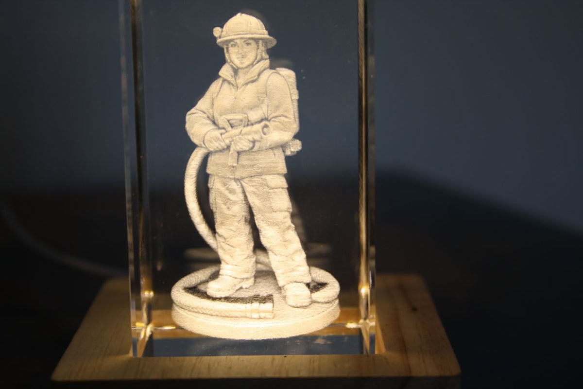 Firefighter engraved inside a crystal block